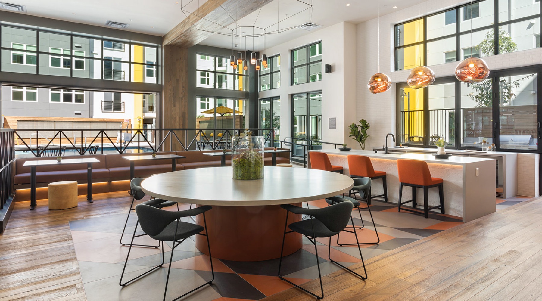 Clubroom Spacious and well lit clubroom with plenty of seating including a large round community table.