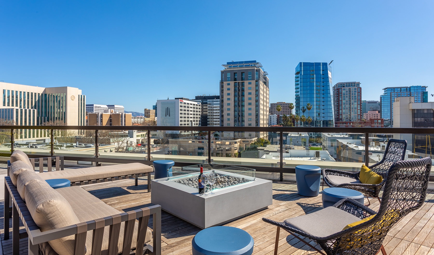 Rooftop Patio Spacious rooftop patio with a fire pit overlooking the city