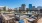 Large rooftop deck with a fire pit and a view of the city